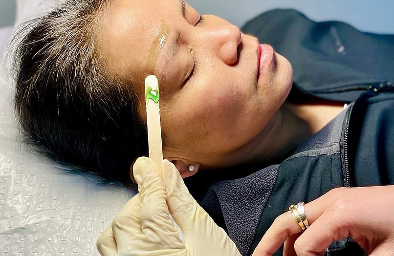 Image of wax applied above eyebrow at Princess Nails Spa and Beauty