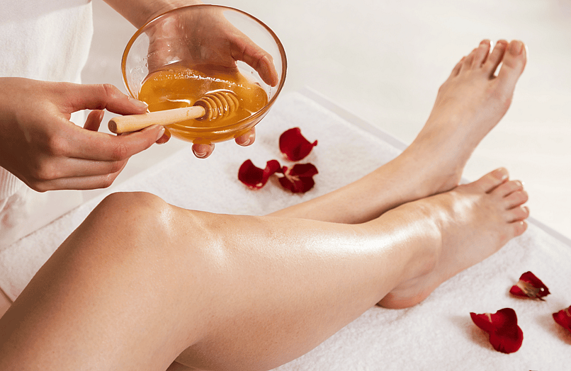Image of wax application on legs 