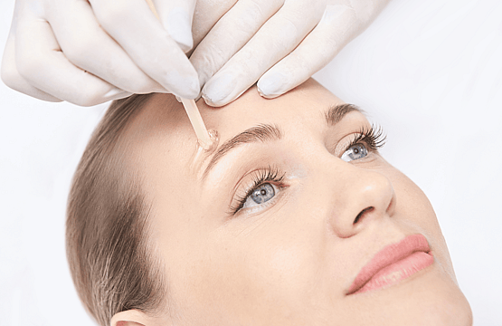 Image of applied wax above eyebrow at Princess Nails Spa and Beauty