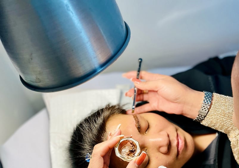 Image of Sophie tinting eyebrows at Princess Nails Spa and Beauty
