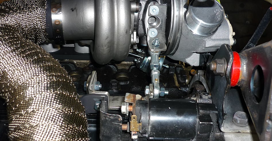 In this photo there are x2 types of bracing the rose joint that is Triangulating the weight of the turbo and the downpipe brace with a simple re-movable section for ease of fitment and access