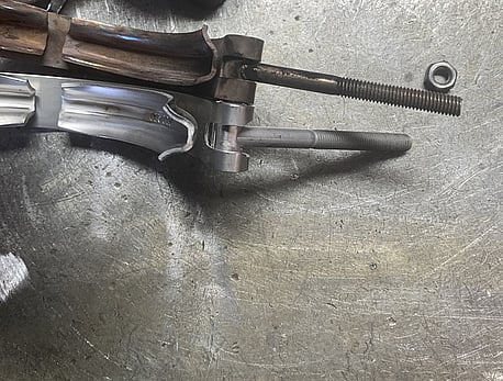 This photo shows the top clamp with the retainer cut off to allow the clamp to pull up correctly on the flange without hitting on the body of the turbo