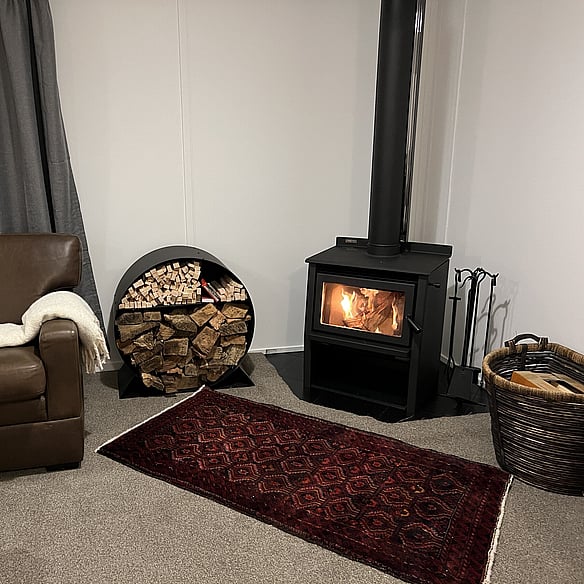 Turangi BnB log fire place and lounge