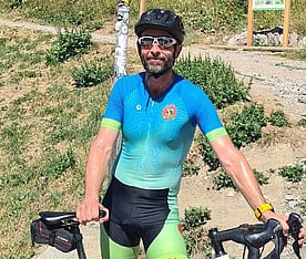 Thomas Armingeat standing with his road bicycle