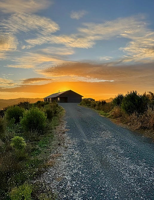 Image of dark exterior cladded new build home with Waikato rural outlooks. Built by Otorohanga builders, Coull Builders.