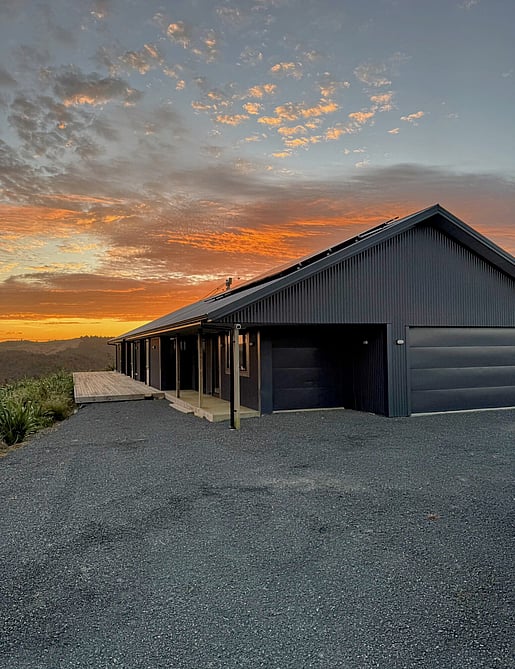 Image of dark exterior cladded new build home with Waikato rural outlooks. Built by Otorohanga builders, Coull Builders.