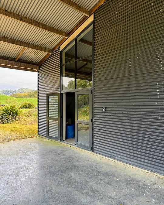 Dark exterior cladded office space in Waitomo by Coull Builders