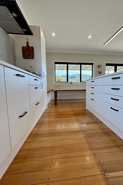 Close up of the cabinetry in light, airy and updated kitchen in a weatherboard home by Coull Builders, Otorohanga.