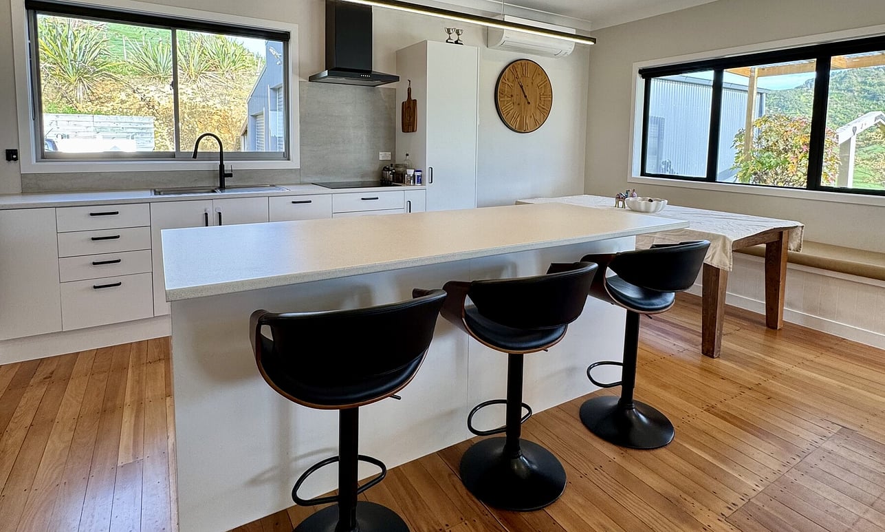 Light, airy and updated kitchen in a weatherboard home by Coull Builders, Otorohanga.