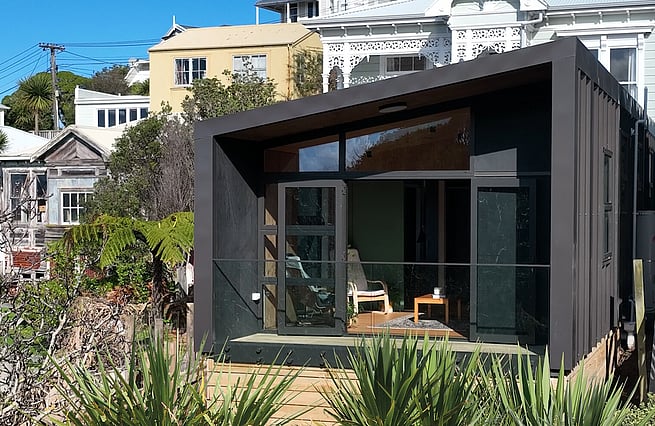 Front view of house on a hillside shot from drone