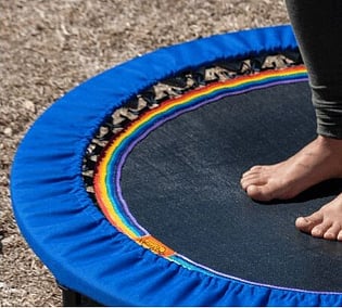 Close up of bare feet health-bouncing on a XenPod Lymphaciser