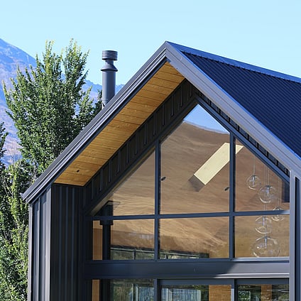 A Glenorchy home with pitched ceilings and large glass front windows.