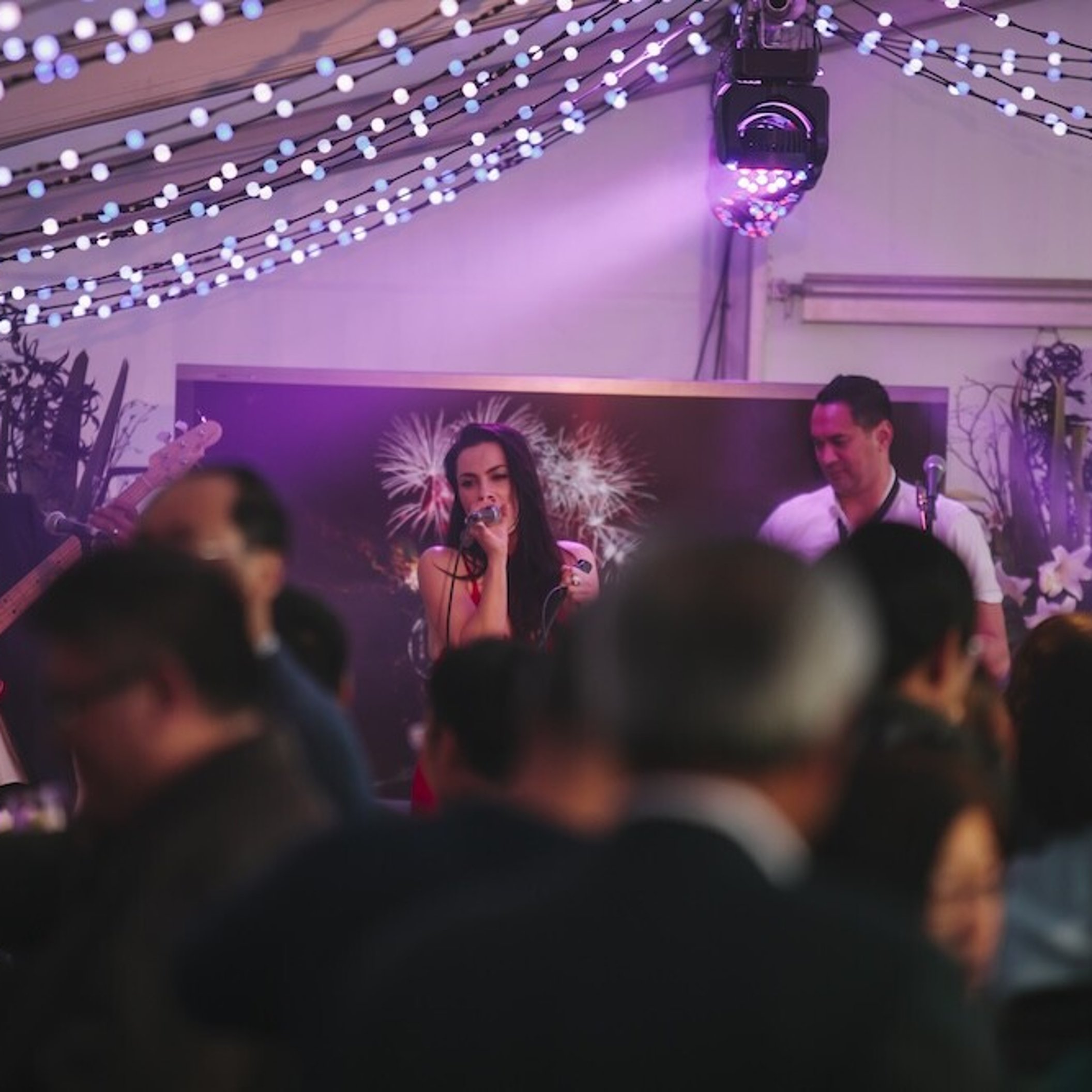 Musicians performing on a stage at an event designed and planned by Little Big Events.