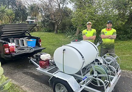Photo of Aqua Force team standing by work ute and equipment