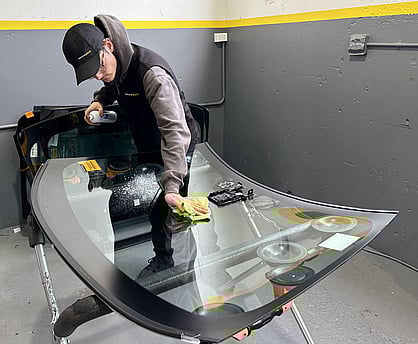 Secure Glass staff member applying windscreen glass treatment