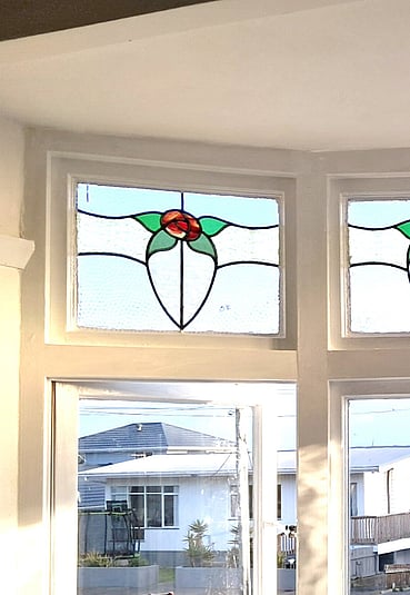 Stained glass windows in white room
