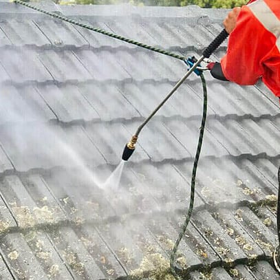 cleaning moss and mould from asbestos building