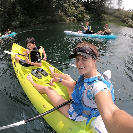 Guide and customers having fun kayaking on our steaming cliffs kayak tour