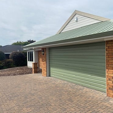 Hamilton home with continuous spouting  matching the roof and garage colour