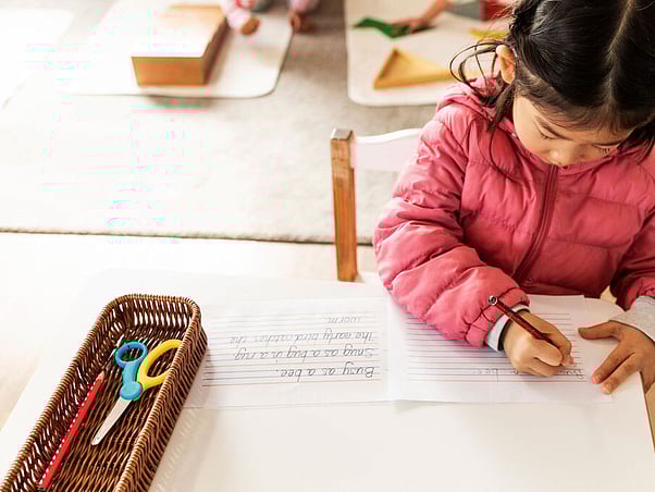 Child choosing work in a prepared Montessori environment