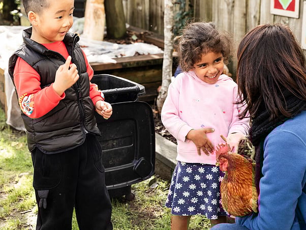 Teacher guiding child with practical life activity &ndash; North Shore