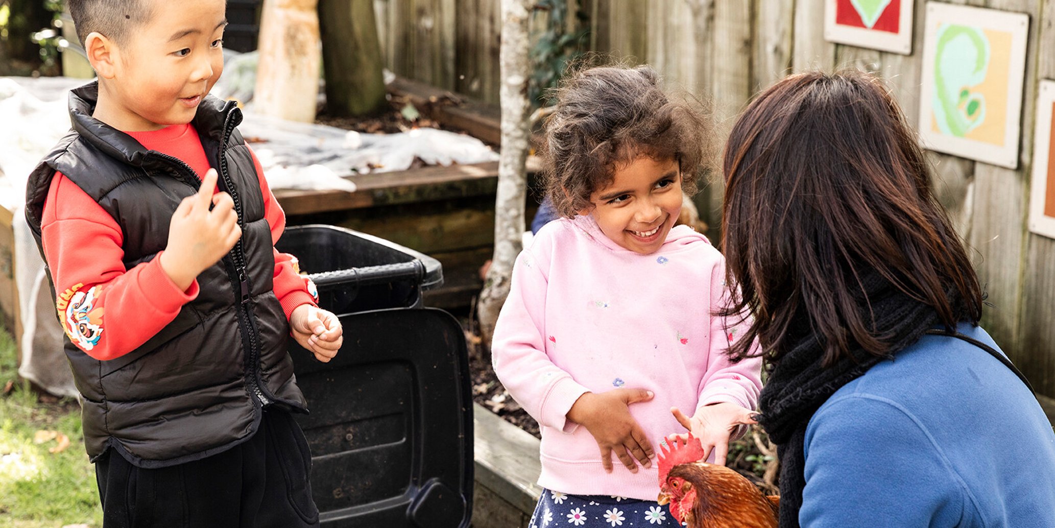 Teacher guiding child with practical life activity &ndash; North Shore