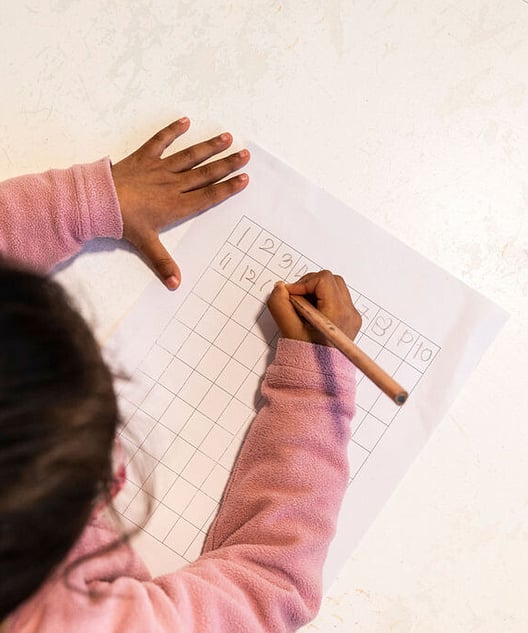 Child choosing work in a prepared Montessori environment