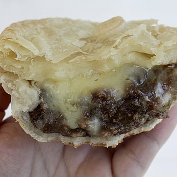 Mince and cheese pie with cheese oozing