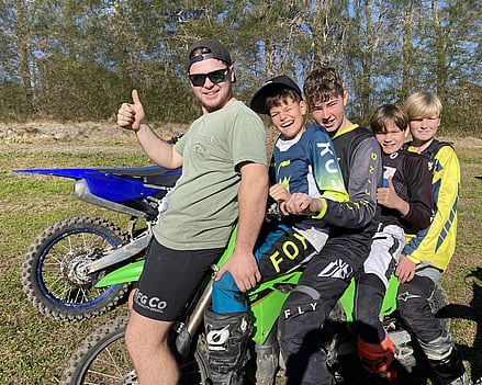 5 Happy youth on a dirt bike