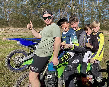 5 Happy youth on a dirt bike