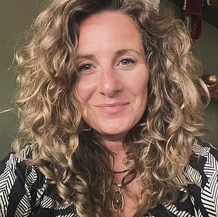 Holly Scott owner of Harvest with blonde, textured, wavy hair with a fringe wearing bohemian jewellery.