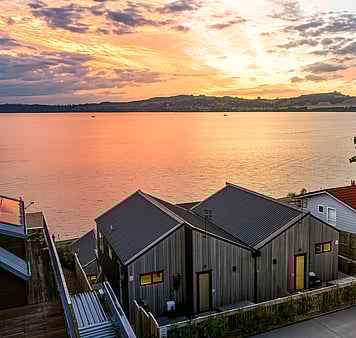 Deck and dining on the lakefront accommodation at Roam, Taupo