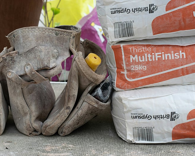 Paintbrush and plaster for plastering services