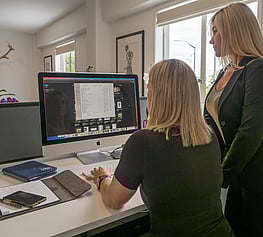 Two ladies looking at a computer
