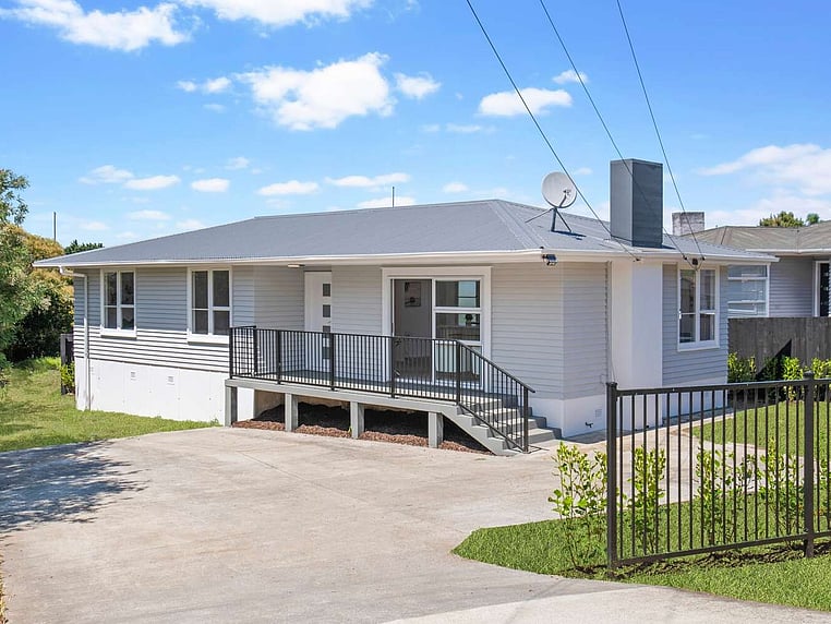 Image of a residential home renovation. Newly cladded, decked and landscaped by Auckland builders, Eden Construction. New Zealand.