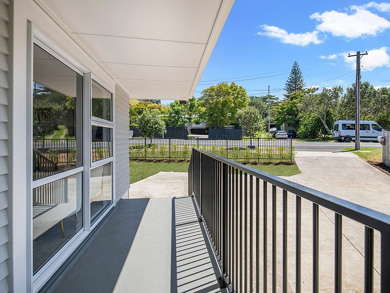 Image of a residential home renovation. Newly cladded, decked and landscaped by Auckland builders, Eden Construction. New Zealand.