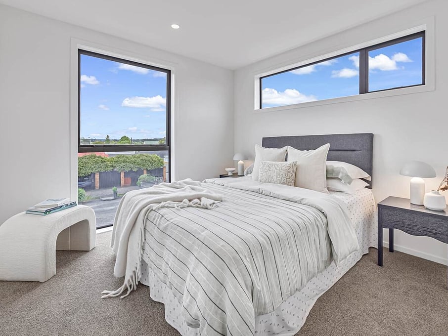 Image of modern bedroom inside one of six architecturally designed family townhouses on Tapu Road, Huapai, Auckland. Built by Auckland builders, Eden Construction. New Zealand.