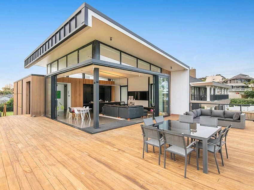 Image of a residential home renovation. Photo of exterior and landscape before renovation.