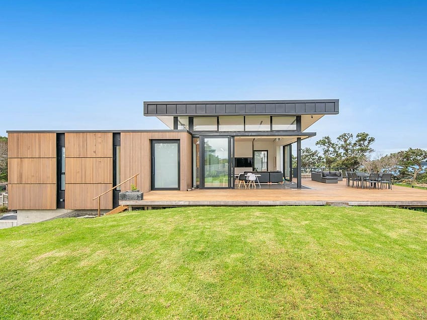 Image of a residential home renovation. Photo of exterior and landscape before renovation.