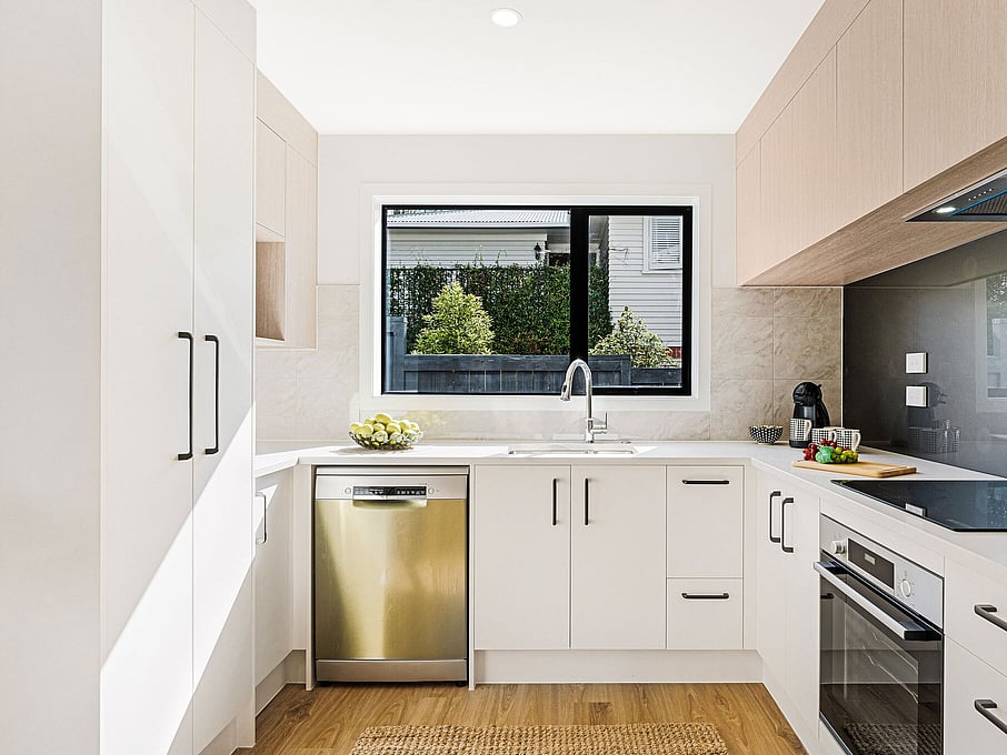 Image of the kitchen inside the residential new build townhouses on Roland Hill, Glen Eden, Auckland. Built by Auckland builders, Eden Construction. New Zealand.