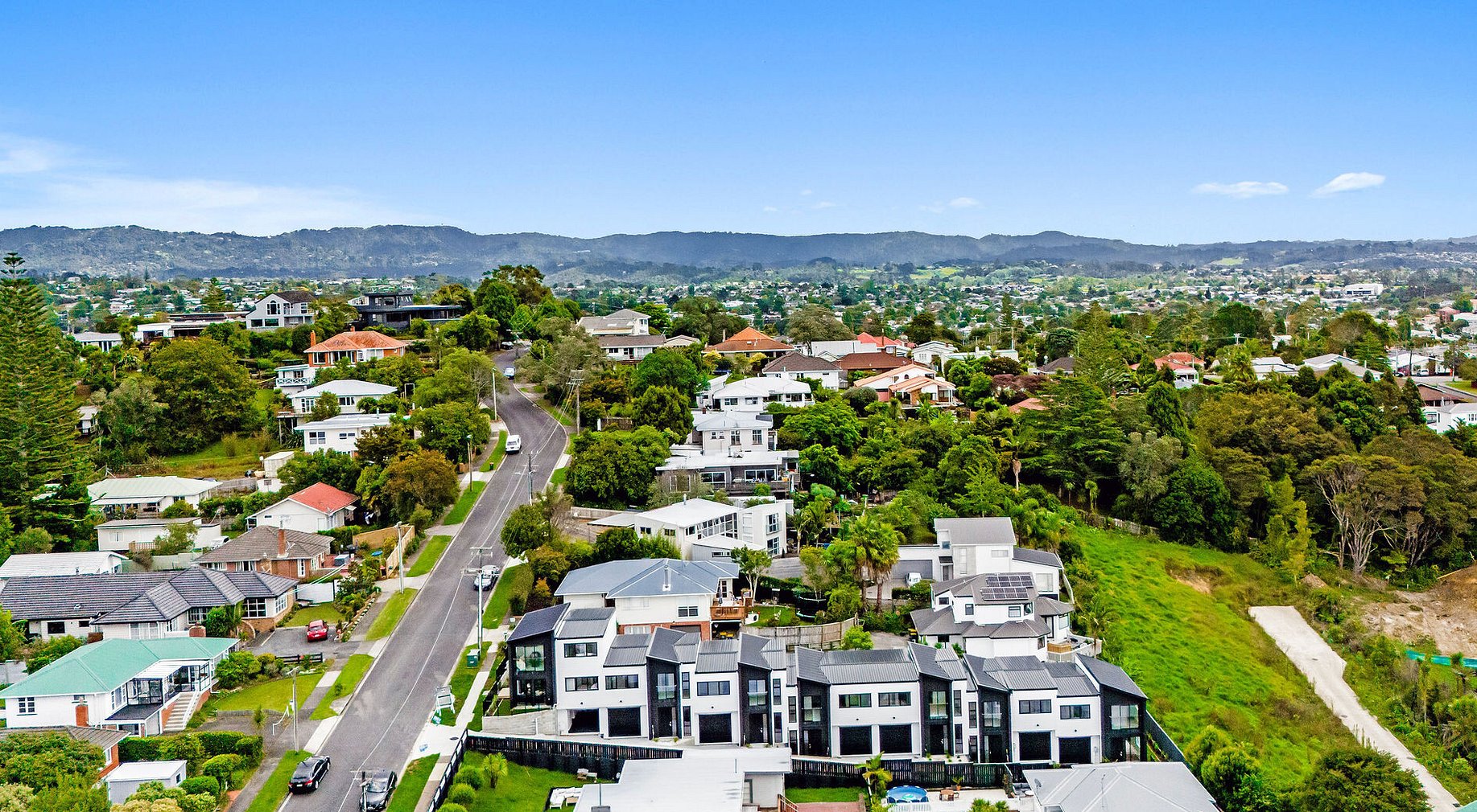 Image of a residential new build home. Newly constructed modern townhouses on Roland Hill, Glen Eden, Auckland. Built by Auckland builders, Eden Construction. New Zealand.