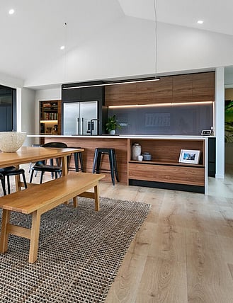 Interior image showing Quick Step Majestic flooring installed in a kitchen and dining room.