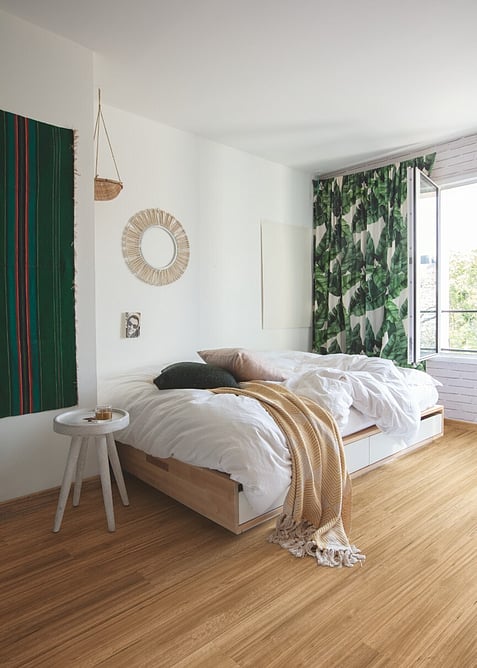 Bamboo look hybrid floor in a modern bedroom