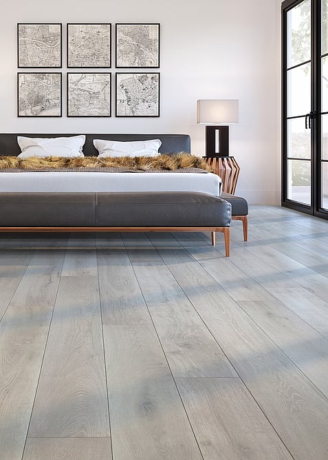 Grey Cork flooring in the style of wood planks. Image shows the hard flooring in a bedroom.