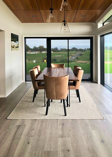Grey CorkWood flooring in a dining room.