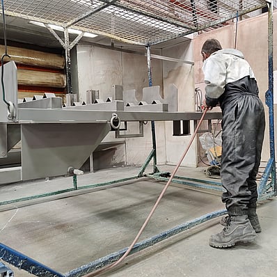 Photo of Hamilton Industrial Powdercoating team member zinc priming steel