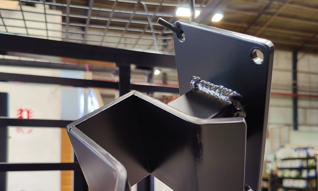 Photo of an automatic gate latch powder coated in gloss back by Hamilton Industrial Powder Coating