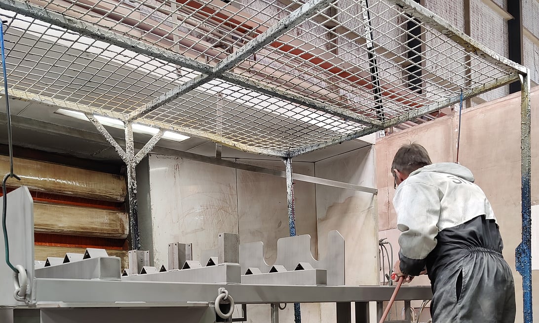 Photo of Hamilton Industrial Powdercoating team member zinc priming steel