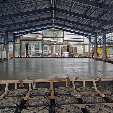 Freshly laid smooth concrete floor of a warehouse