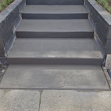 outdoor garden steps with a smooth concrete finish
